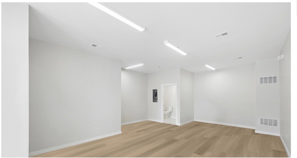 Finished retail interior looking toward the storefront at 4041 Lancaster Avenue